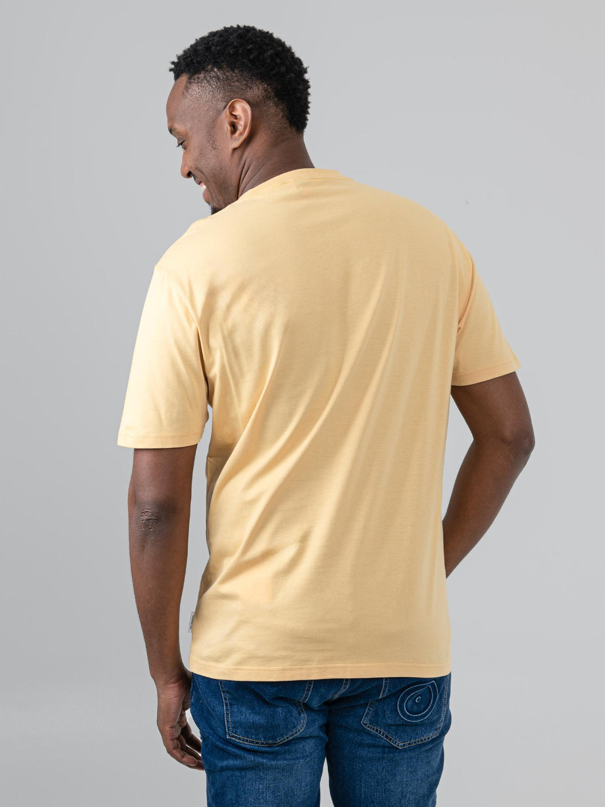 Ben Sherman Hidden Ace Tee in New Wheat - back view of men's soft cotton graphic t-shirt