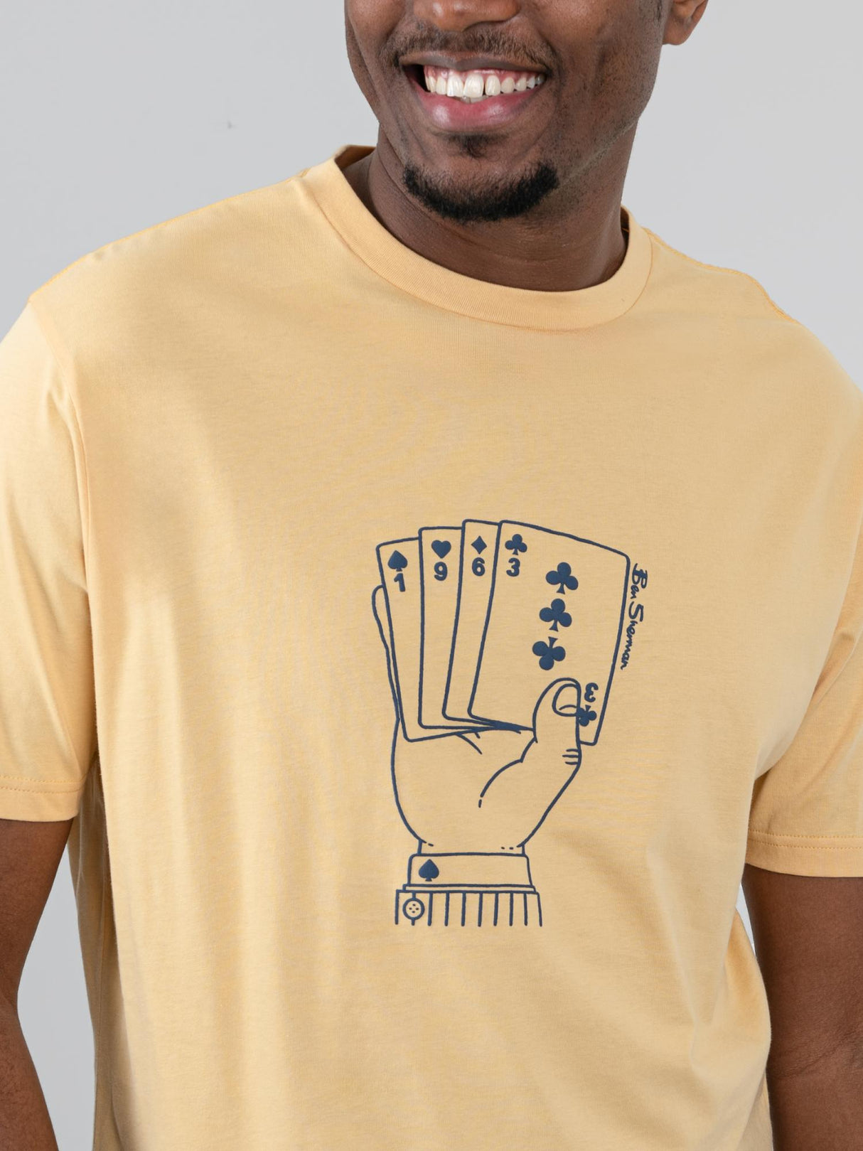 Ben Sherman Hidden Ace Tee in New Wheat - close-up of the ace card hand graphic print on chest