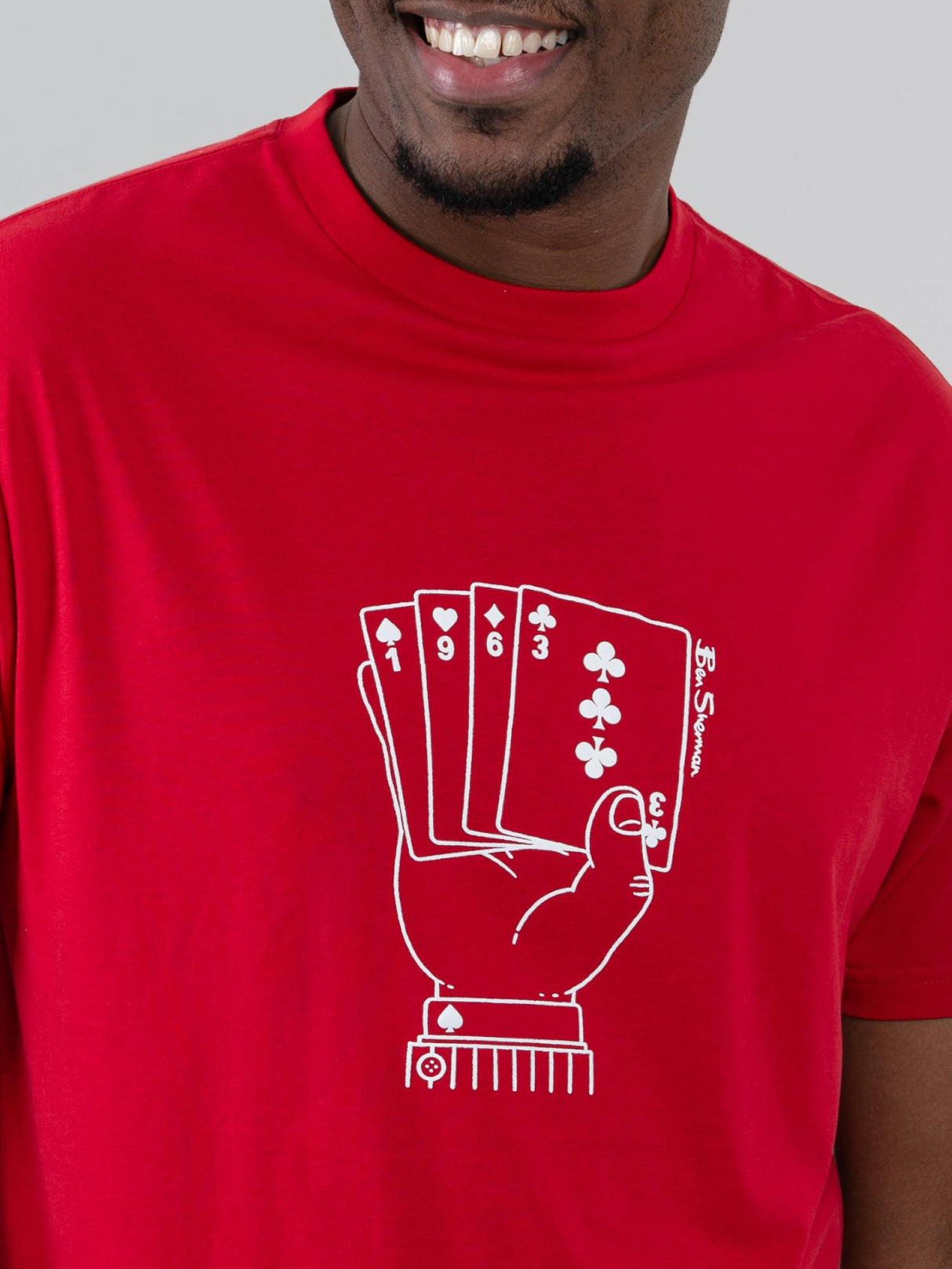 Ben Sherman Hidden Ace Tee in Red - close-up of the ace card hand graphic print on chest