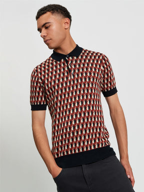 Ben Sherman All Over Jacquard Polo in Black - man wearing knitted polo with geometric all-over jacquard pattern and contrast black collar and cuffs