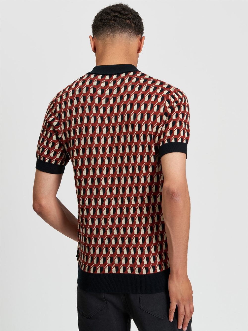Ben Sherman All Over Jacquard Polo in Black - back view of men's knitted polo with geometric all-over jacquard pattern and contrast black ribbed collar and cuffs