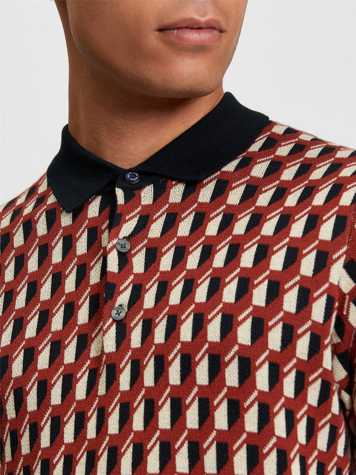 Ben Sherman All Over Jacquard Polo in Black - close-up of geometric jacquard knit texture, contrast black polo collar and three-button placket