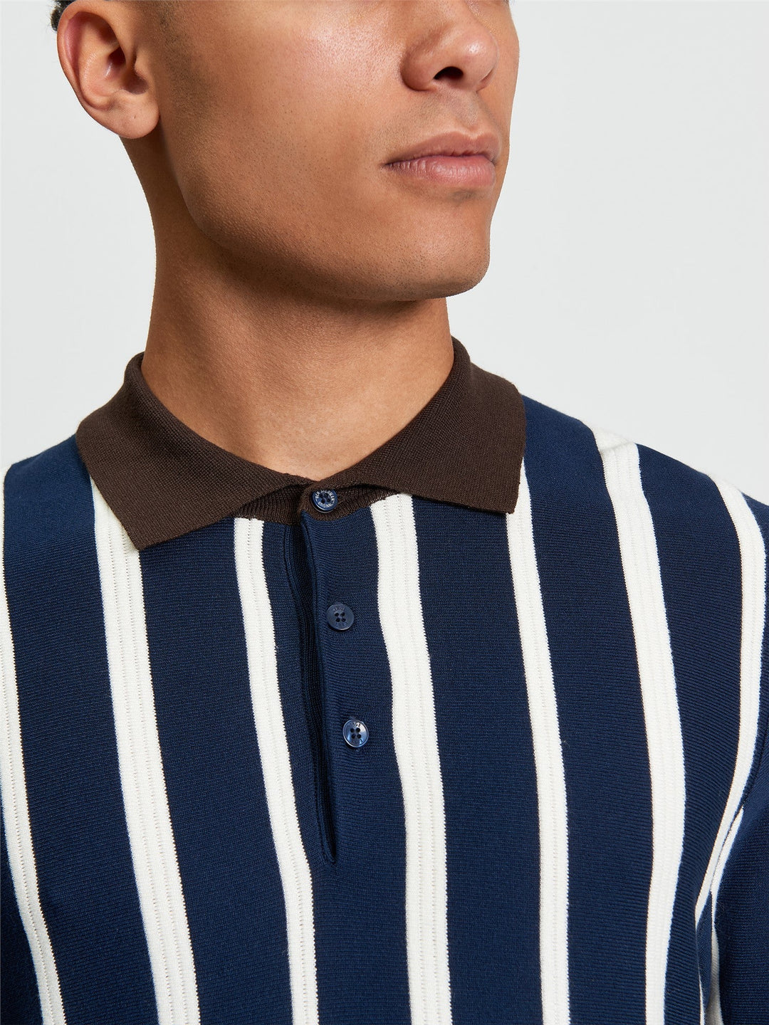 Ben Sherman Raised Stripe Polo in Dark Navy - close-up detail of raised stripe knit texture and polo collar with contrast brown tipping