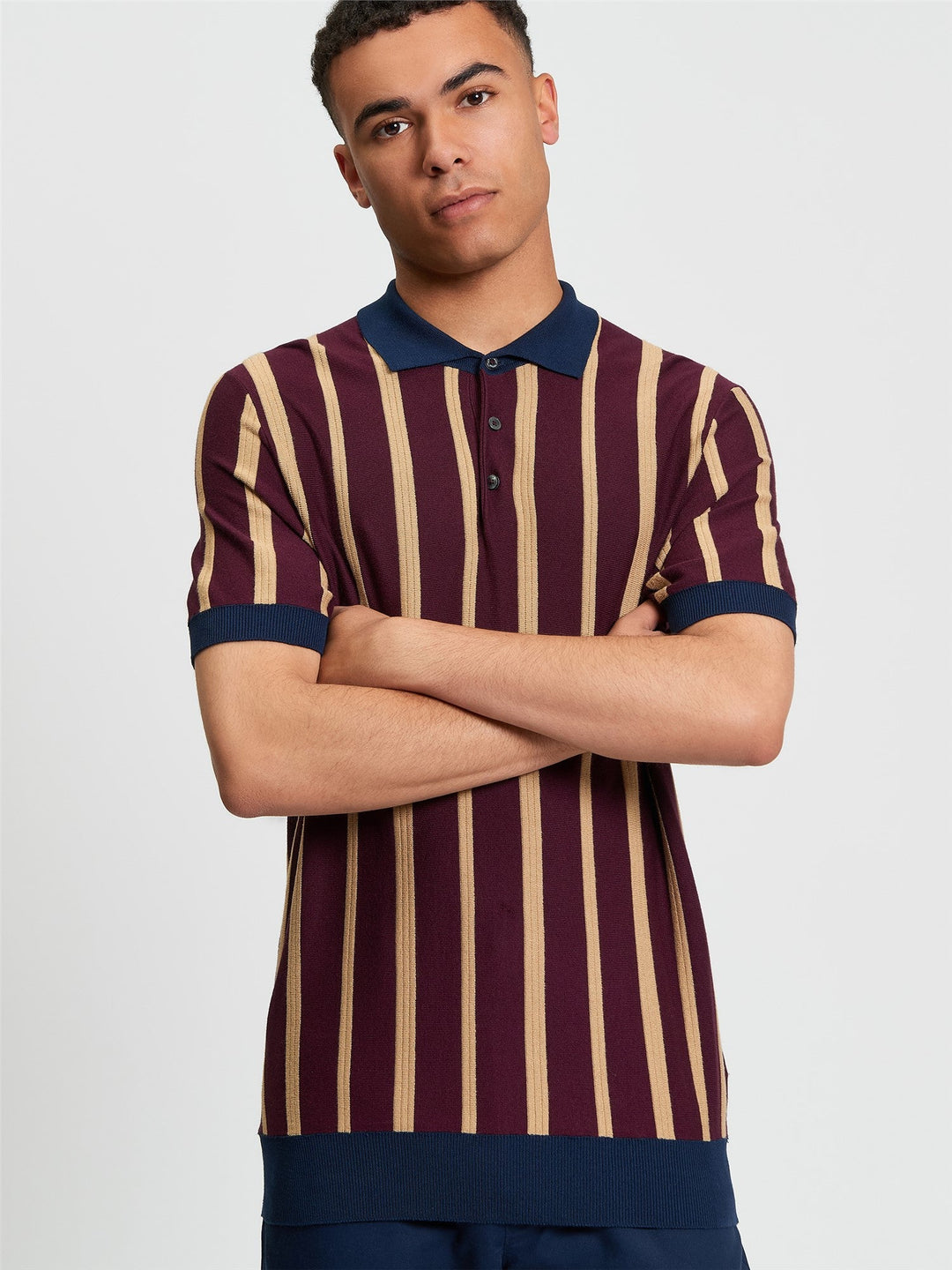 Ben Sherman Raised Stripe Polo in Dark Wine - model wearing front view showing raised stripe knit design with contrast tipping