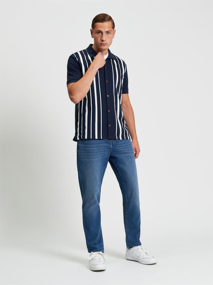 Ben Sherman Button Through Stripe Polo in Dark Navy - full length view showing relaxed fit button-through polo with vertical stripe design