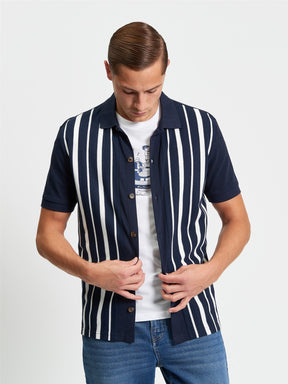 Ben Sherman Button Through Stripe Polo in Dark Navy - model wearing front view showing pique stripe design with full button placket and white stripe detail