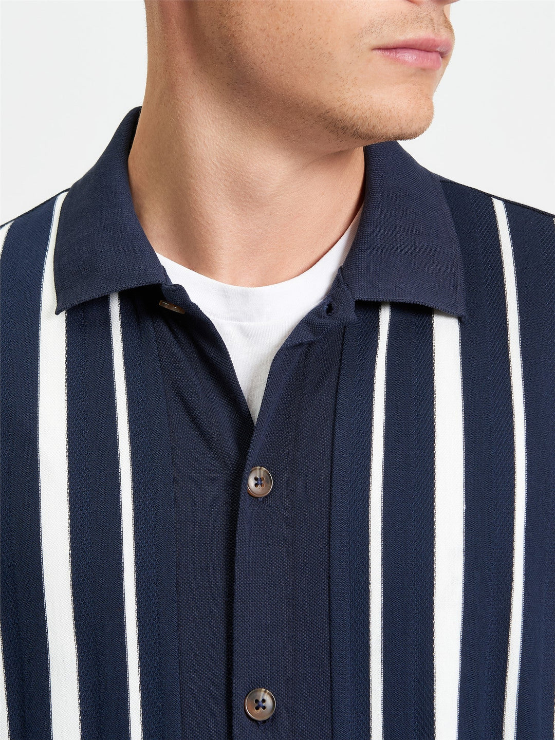 Ben Sherman Button Through Stripe Polo in Dark Navy - close-up detail of pique stripe texture with button placket and spread collar