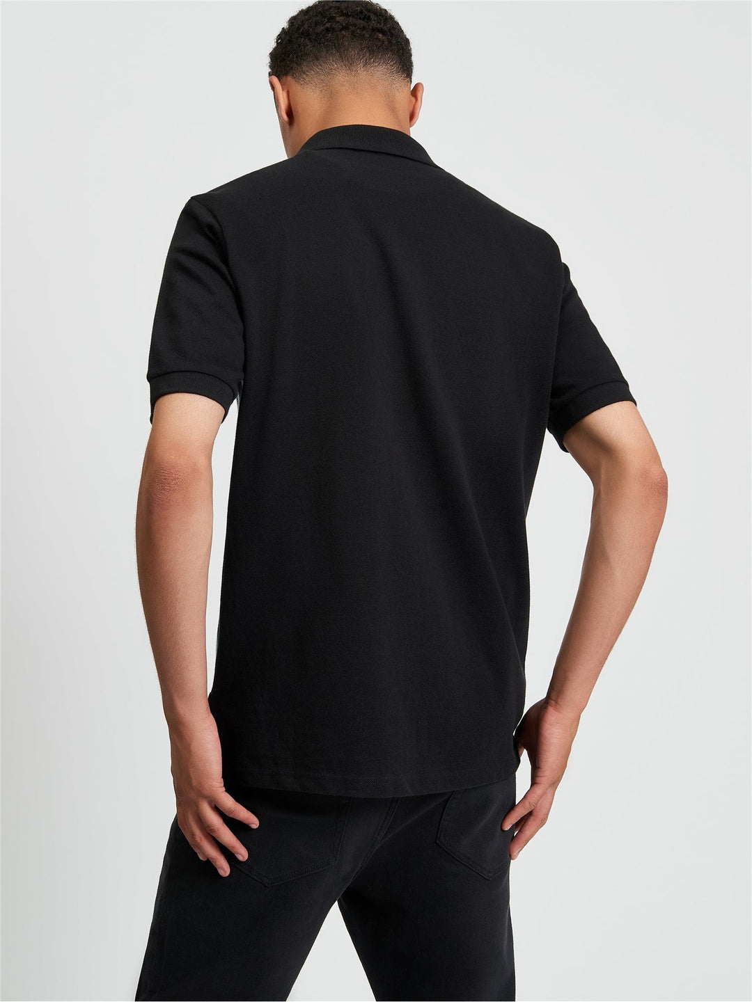 Ben Sherman Button Through Stripe Polo in Black - back view showing textured pique stripe fabric and relaxed fit silhouette
