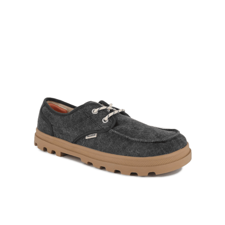 Dunelite Moc Cushion sneaker in Black - angled front view showing moc-stitch detailing and tan EVA outsole