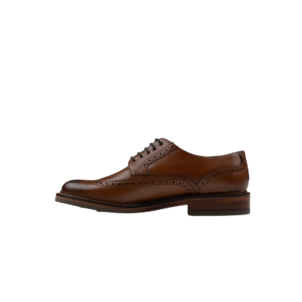 Chapman &amp; Moore leather brogue in Tan – three-quarter view showing full shoe profile, brogue perforations and leather sole with rubber heel