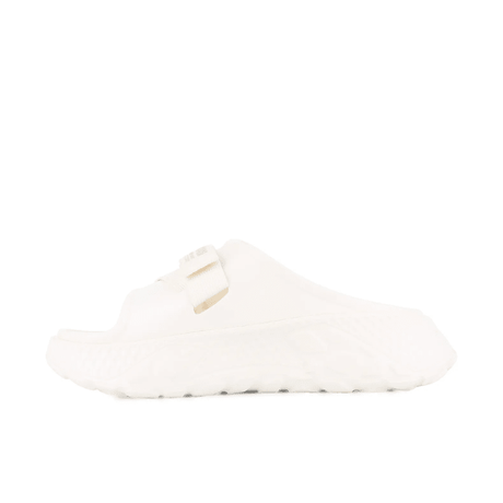 Palladium Offbound Slide in Cream - side profile view highlighting diamond texture outsole and minimal strap