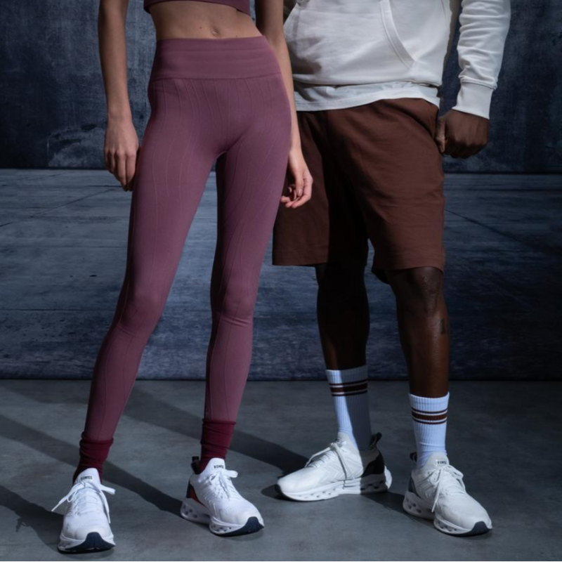 K-Swiss white performance sneakers styled with maroon leggings and brown shorts – premium athleisure South Africa