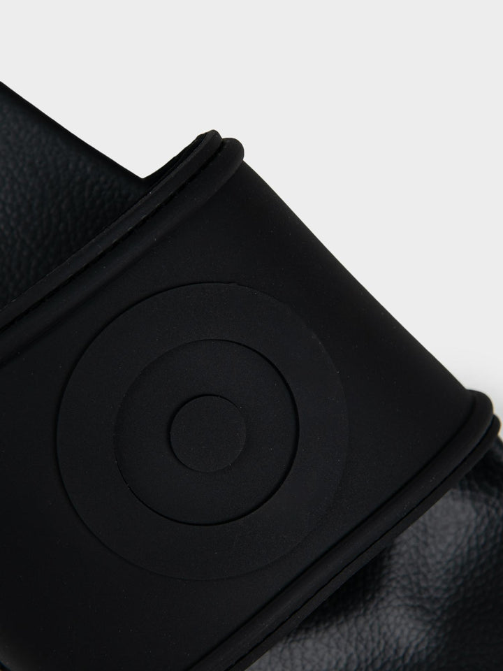 Ben Sherman Target Embossed Slides – Close-Up of Embossed Target Circle on Black Strap