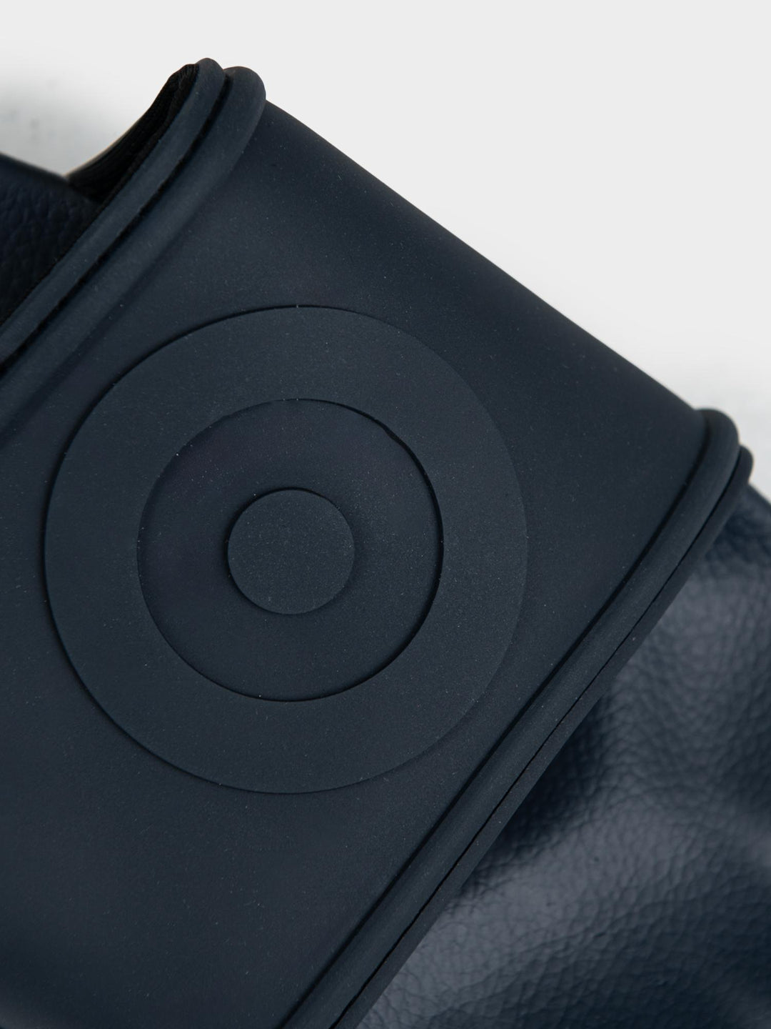 Ben Sherman Target Embossed Slides – Close-Up of Embossed Target Circle on Navy Strap