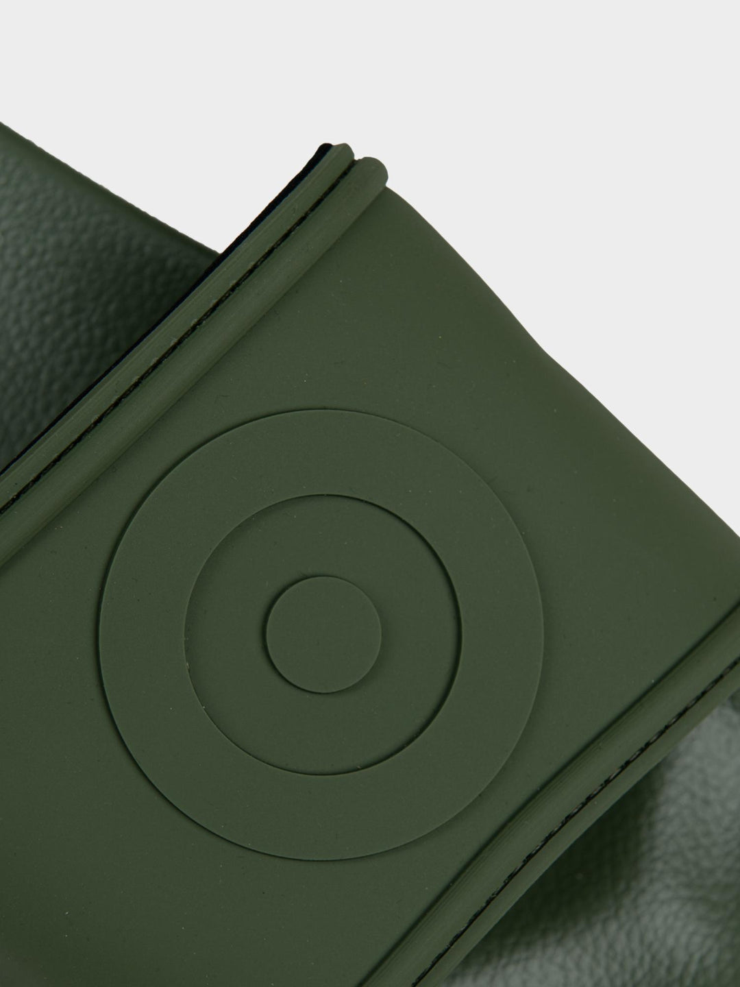 Ben Sherman Target Embossed Slides – Close-Up of Embossed Target Circle on Olive Strap