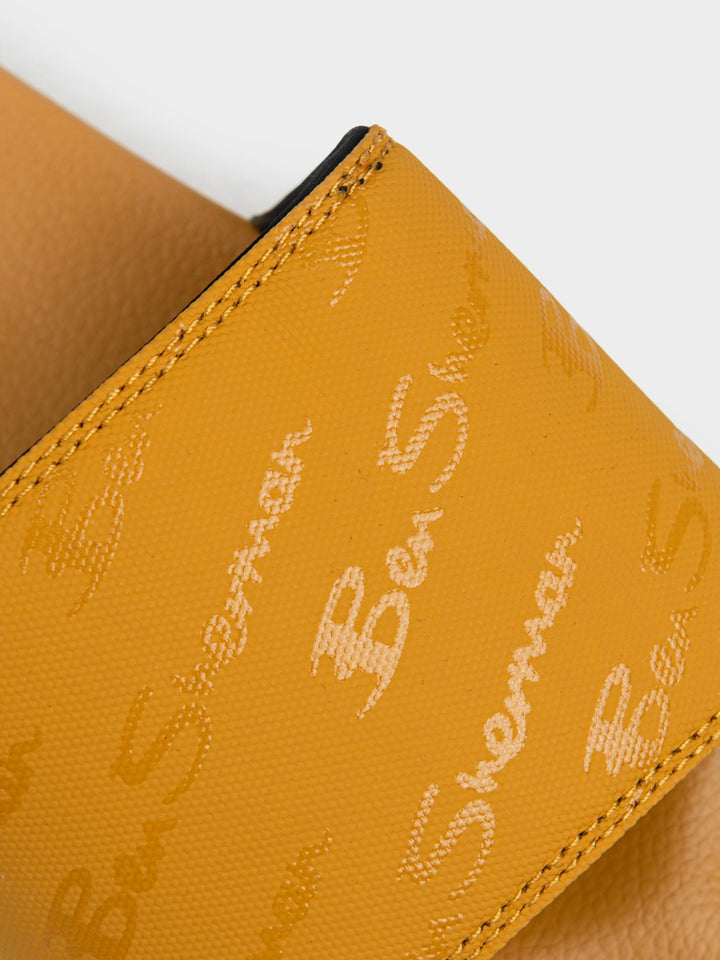 Ben Sherman All Over Script Print Close-Up – Dijon Yellow Slide Strap Detail