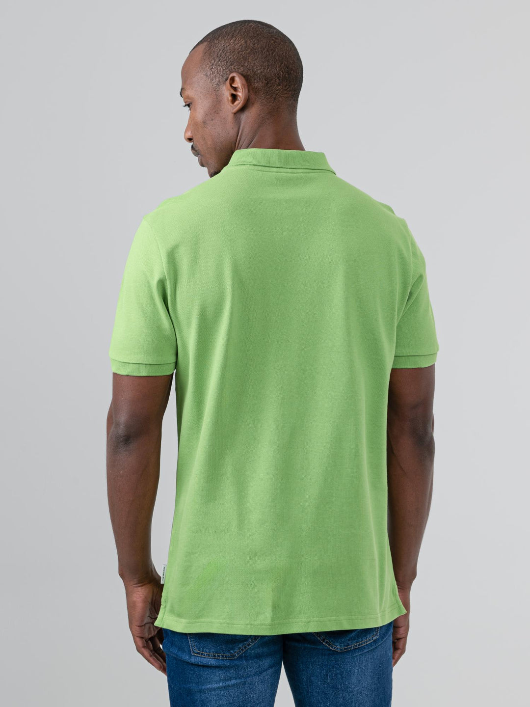 Ben Sherman Ben Polo in Piquant Green - close-up detail showing embroidered Ben Sherman script chest logo on pique cotton