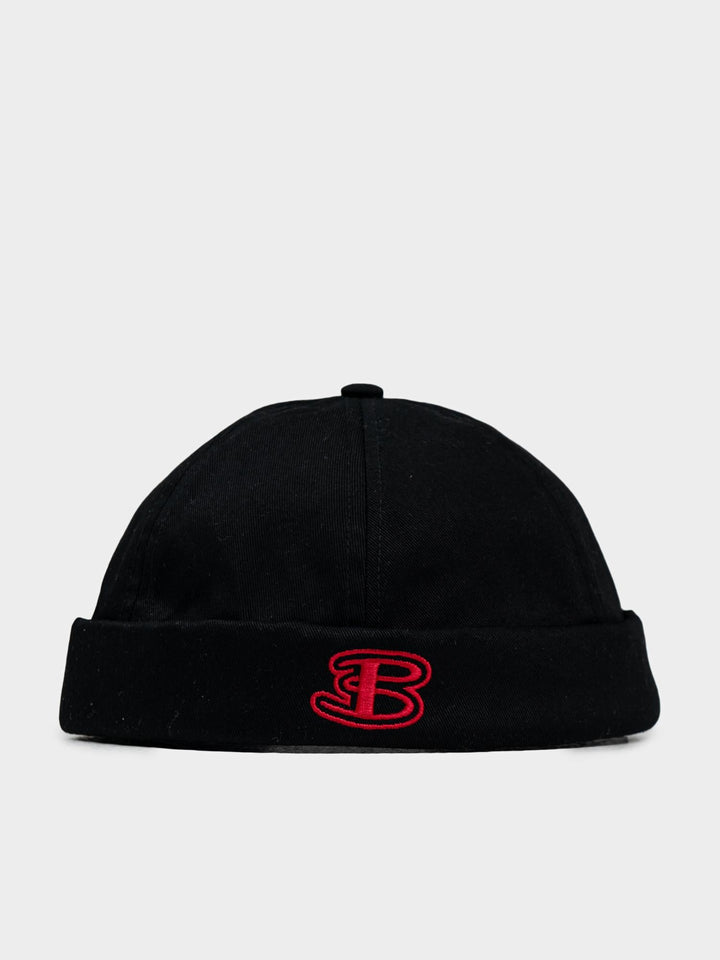 Ben Sherman Docker Hat in Black — front view showing cuffed cotton design with red embroidered B logo branding
