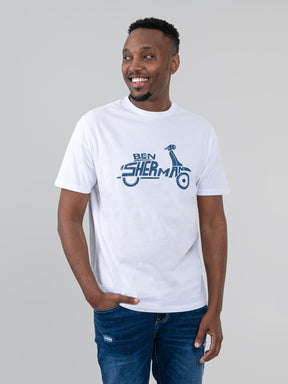Ben Sherman Brand Scooter Tee in White - man wearing crew neck graphic t-shirt with bold navy scooter logo print on white cotton