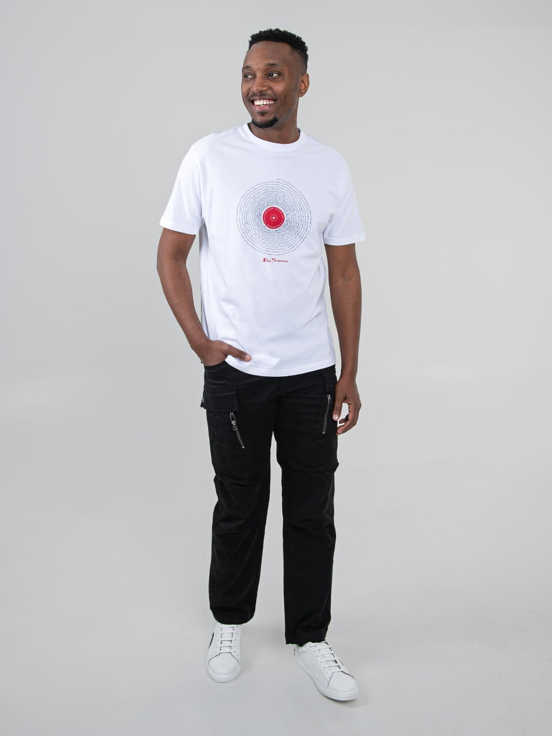 Model wearing Ben Sherman black cargo pants styled with a white graphic tee - full outfit look