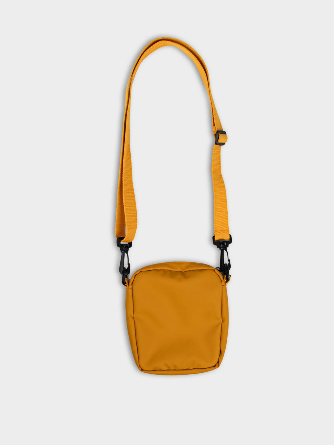 Side view of Ben Sherman Compact Crossbody Bag in Dijon showing zip closure and adjustable shoulder strap