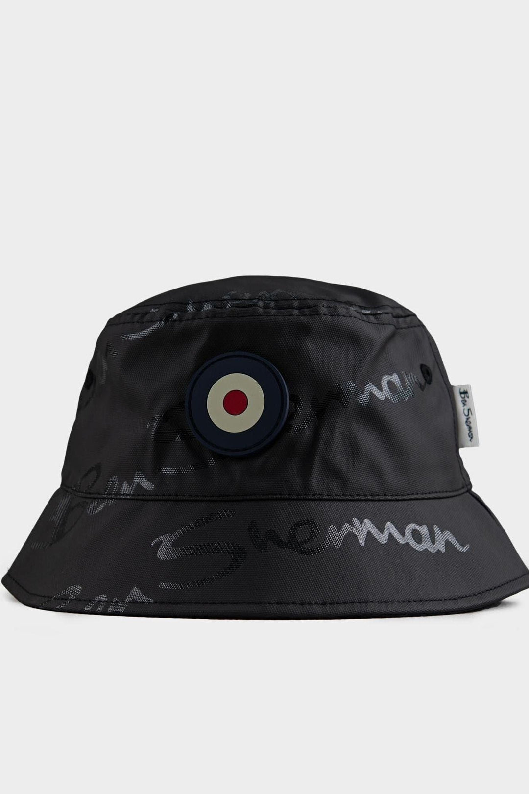 Ben Sherman reversible cotton bucket hat in Black – front view showing target logo and all-over embroidered script print