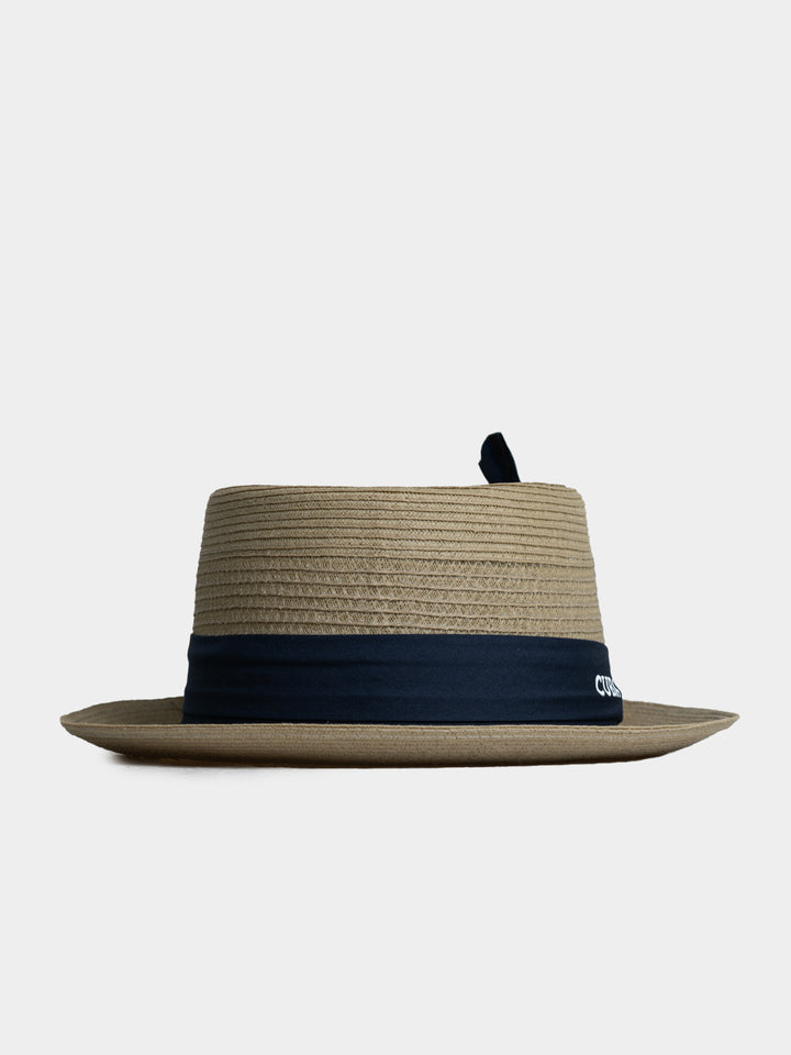 Cuba Libre Beige Pork Pie Straw Hat - side profile view showing flat crown and narrow brim with navy band
