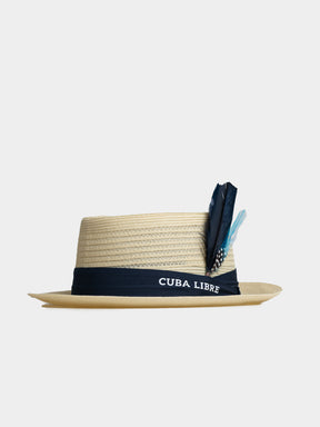 Cuba Libre Pork Pie Hat in Natural - lightweight woven straw, flat crown, narrow brim, navy band and feather accent
