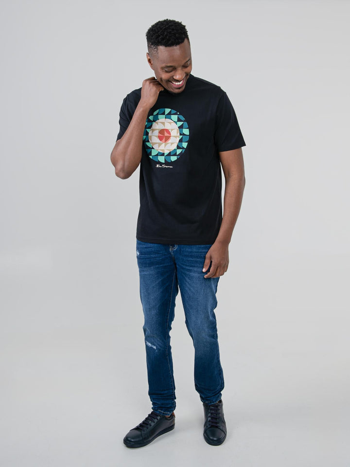 Man wearing Ben Sherman Geo Target T-Shirt in Black — full-length front view with geometric print