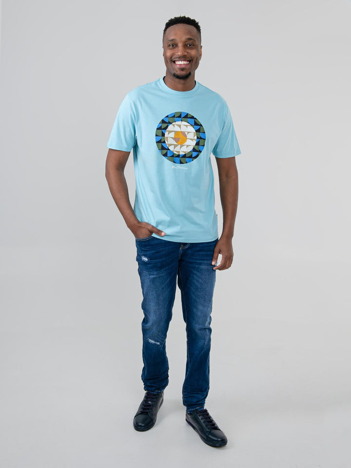 Man wearing Ben Sherman Geo Target T-Shirt in Retro Blue — full-length front view with geometric print