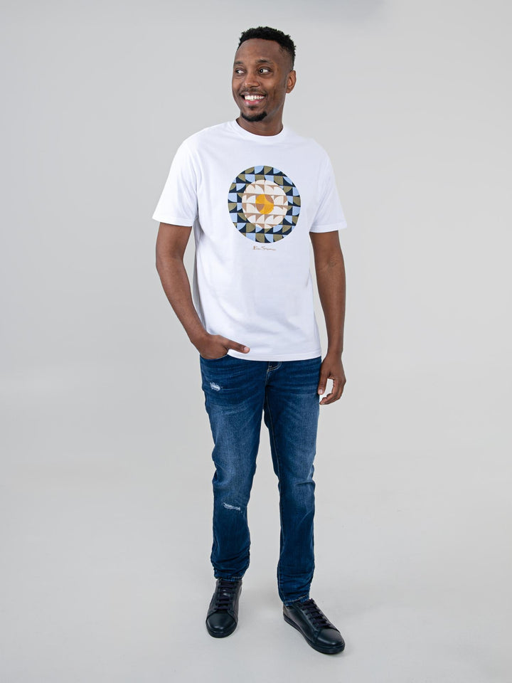Man wearing Ben Sherman Geo Target T-Shirt in White — full-length front view with geometric print