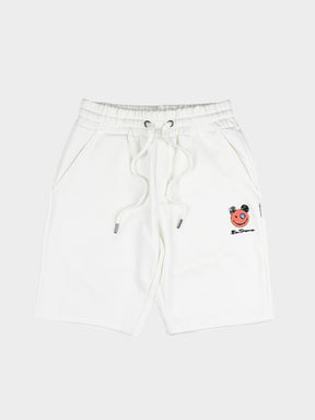 Close-up of embroidered Happy Bear motif and Ben Sherman logo on off-white fleece jog shorts