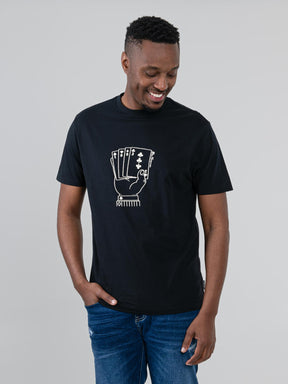 Ben Sherman Hidden Ace T-Shirt in black – men's graphic tee with playing card hand print, worn by male model, front view
