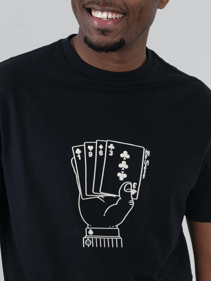 Close-up of Ben Sherman Hidden Ace T-Shirt chest graphic – bold playing card hand print on black cotton fabric