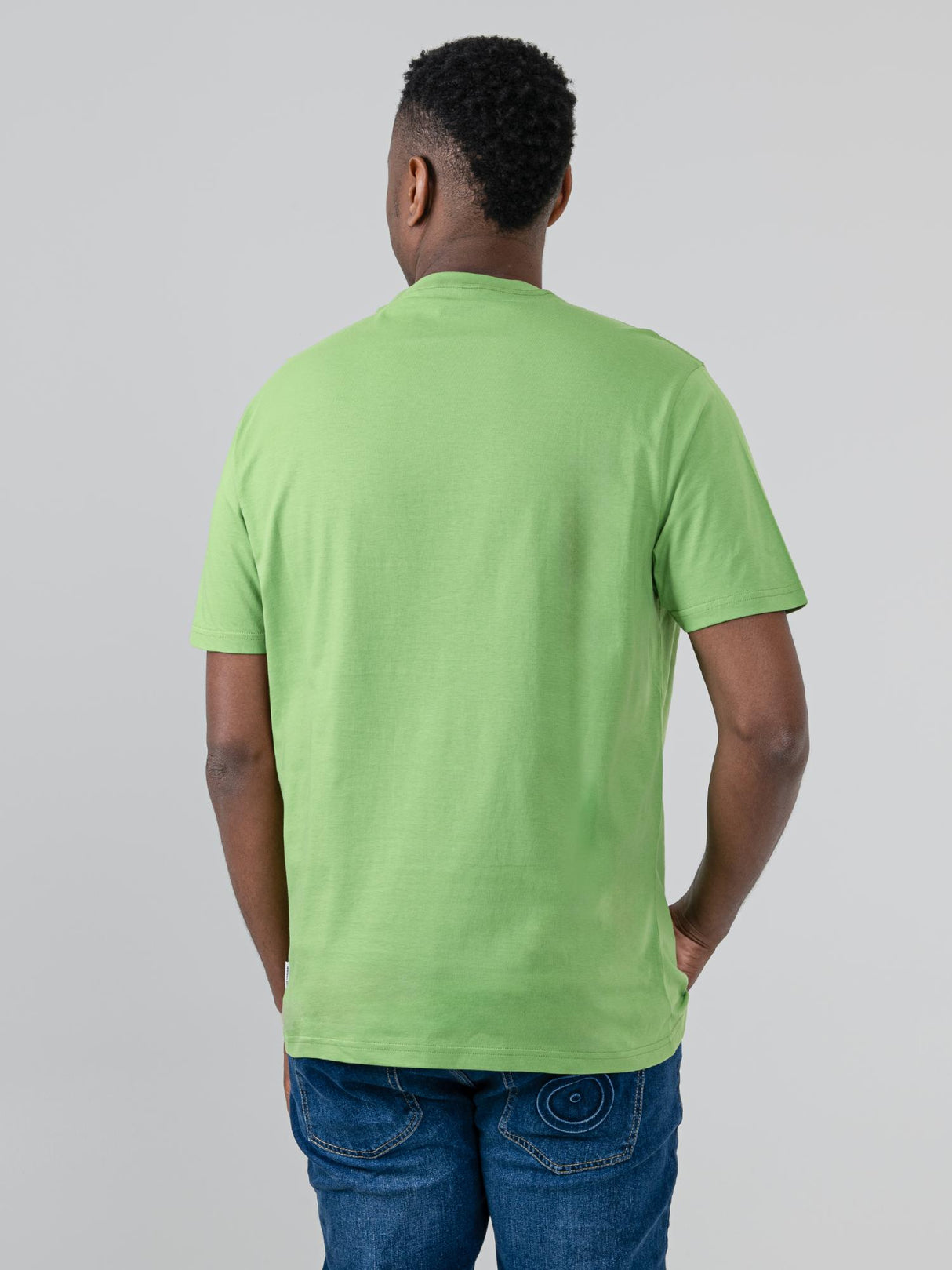 Ben Sherman Hidden Ace Tee in Piquant Green - front view of men's graphic t-shirt with card print