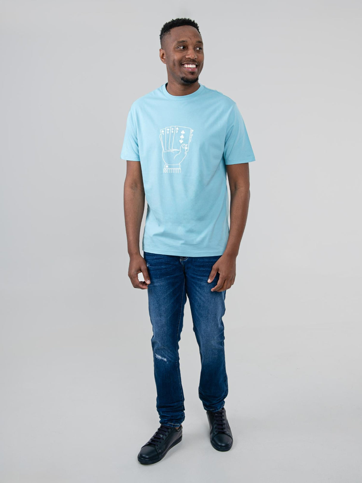 Ben Sherman Hidden Ace Tee in Retro Blue - full-length front view of men's graphic t-shirt styled with jeans