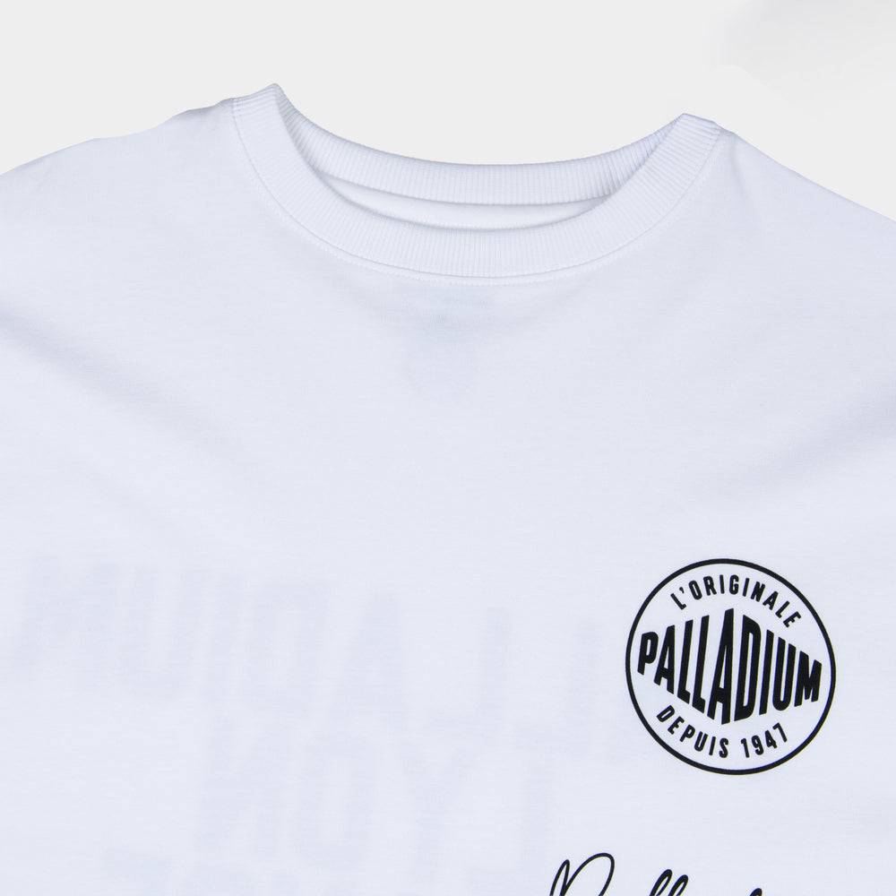 Partisan and Co Signature Oversized White T-Shirt - Close-up of iconic circular logo chest emblem, premium cotton