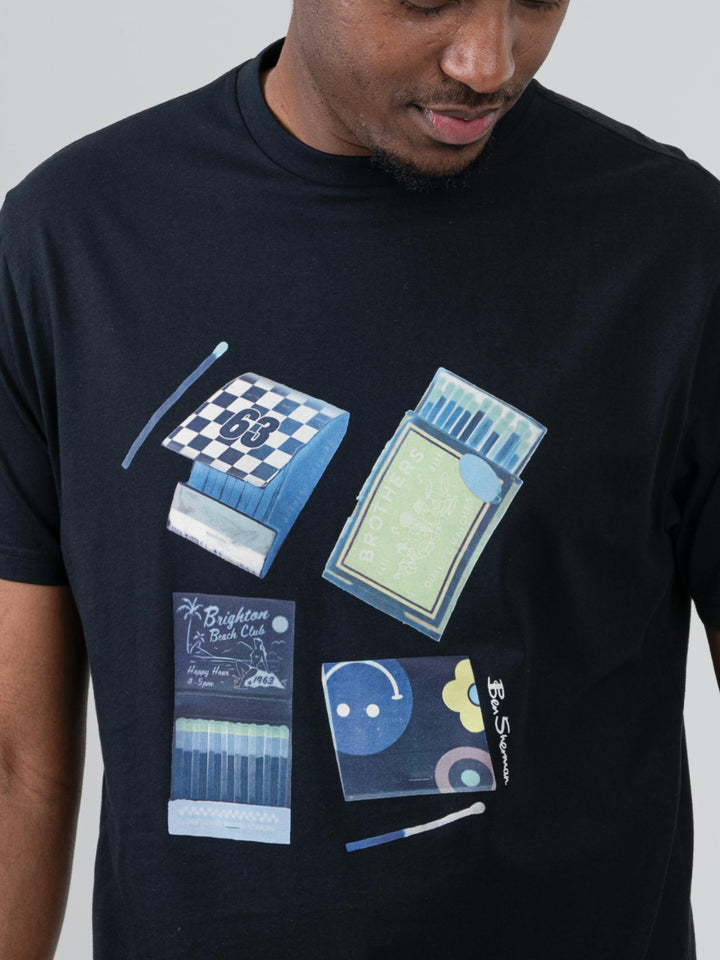 Close-up of Ben Sherman Match Box T-Shirt Black – vintage matchbook multi-print graphic on black cotton tee