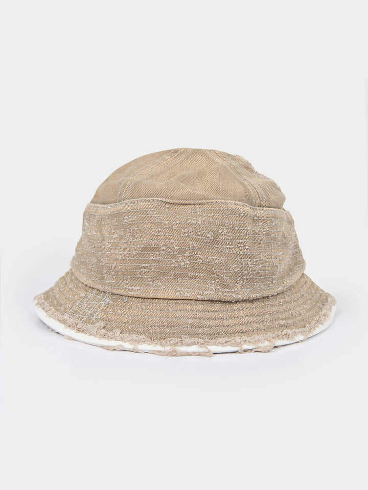 Back view of the stone Palladium frayed bucket hat showing the washed canvas crown and frayed brim