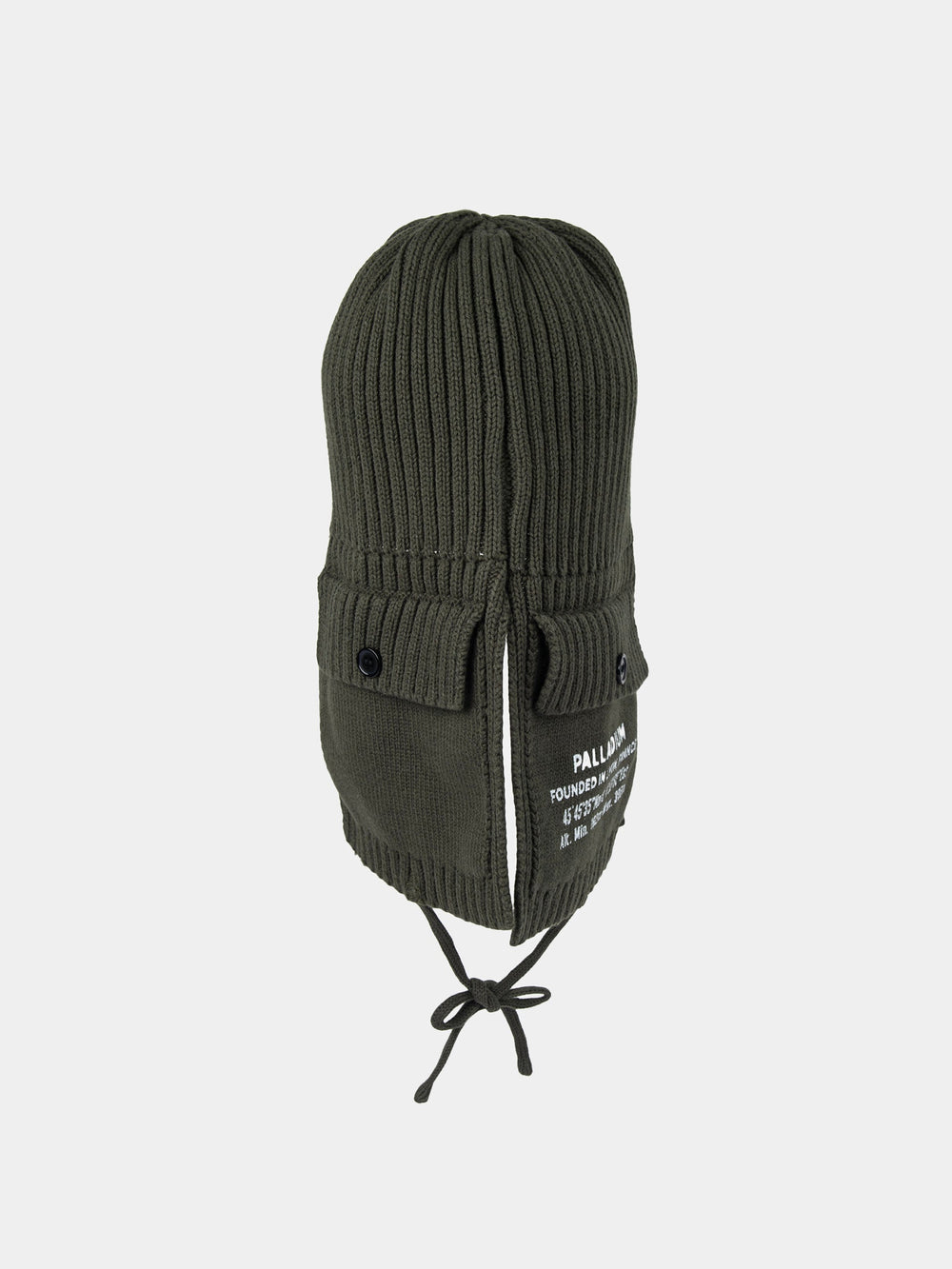 Front view of the olive Palladium Cargo trapper beanie showing button-detail side pockets, Palladium print and tie fastening