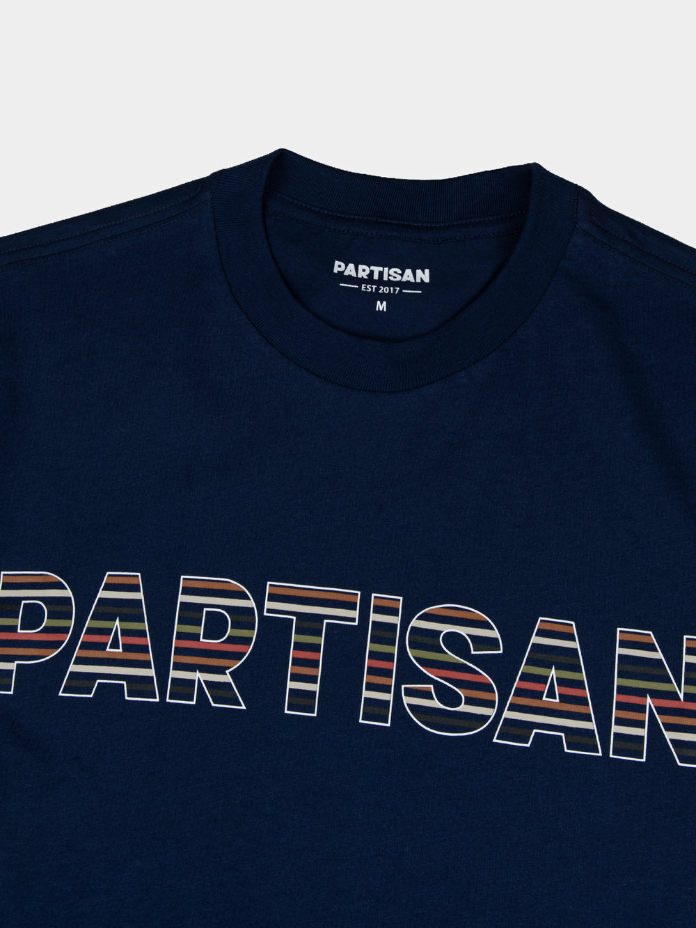 Partisan Stripe Print Tee in Navy – close-up of tonal stripe print logo detail by Partisan and Co