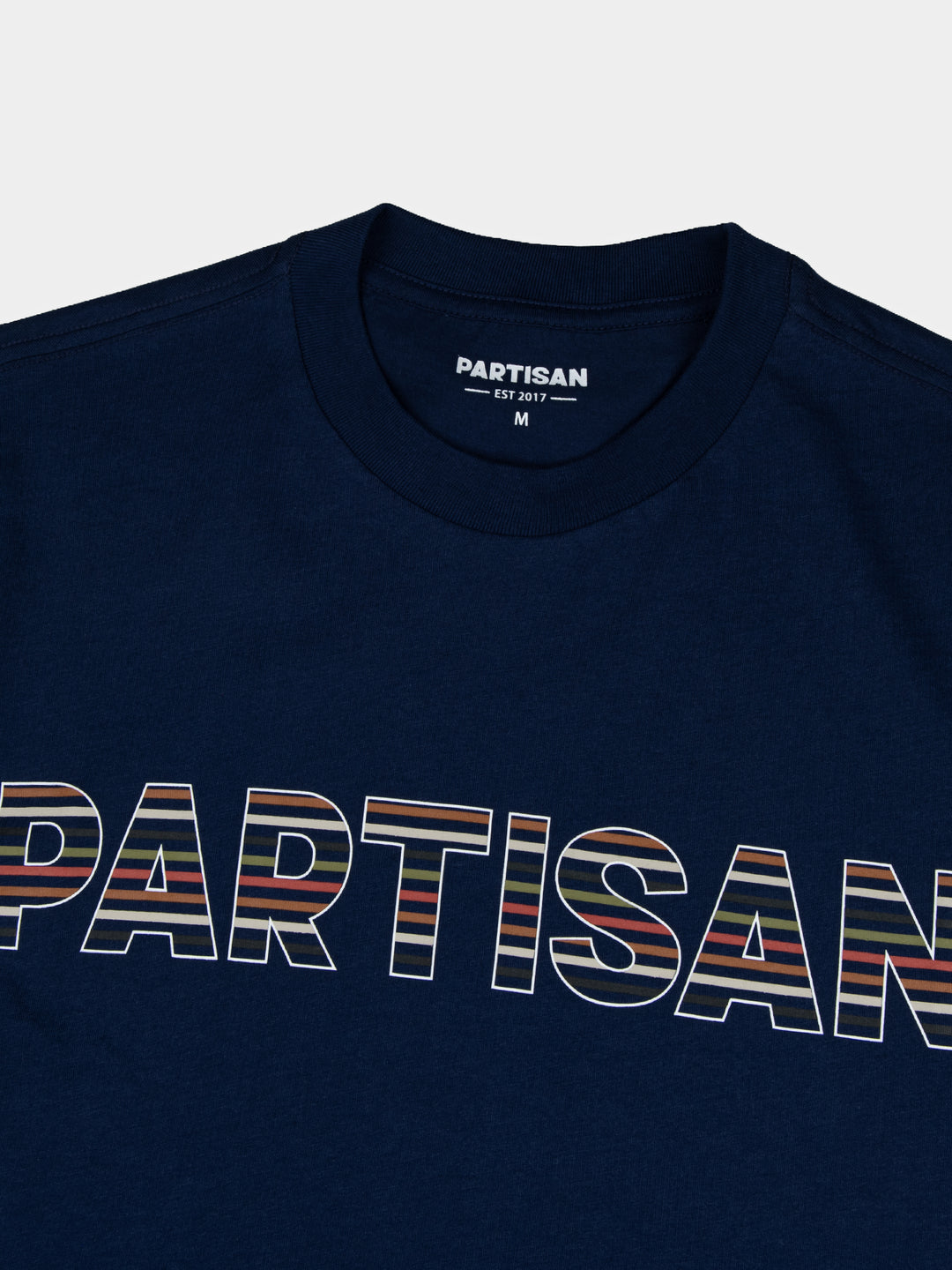 Partisan Stripe Print Tee in Navy – close-up of tonal stripe print logo detail by Partisan and Co