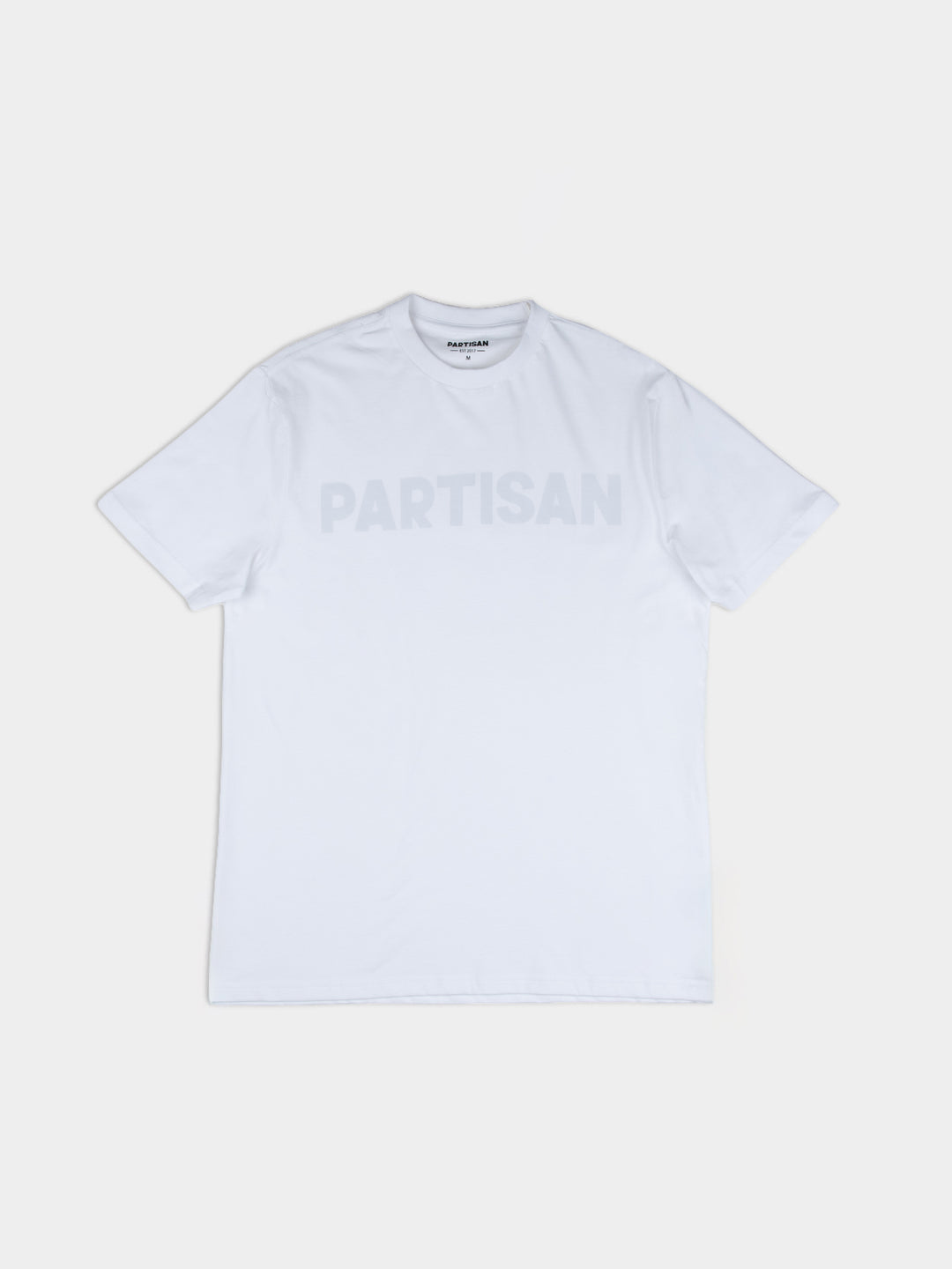 Partisan Tonal Print Tee in White – Men's white graphic t-shirt with tonal Partisan logo, front view on light grey background