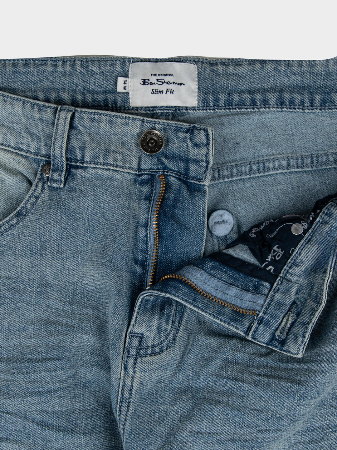 Ben Sherman Slim Fit Abrasion Denim – close-up of waistband with branded label and button detail