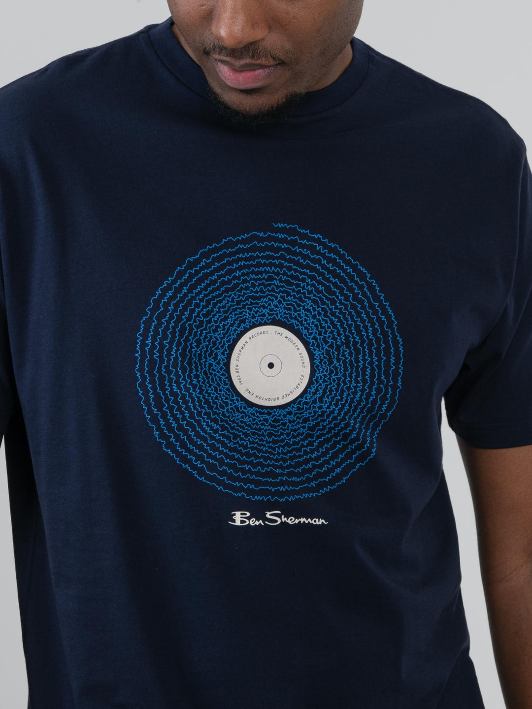 Close-up of Ben Sherman Sound Wave Graphic Tee in Navy – intricate vinyl record chest print with Ben Sherman signature on rich navy cotton