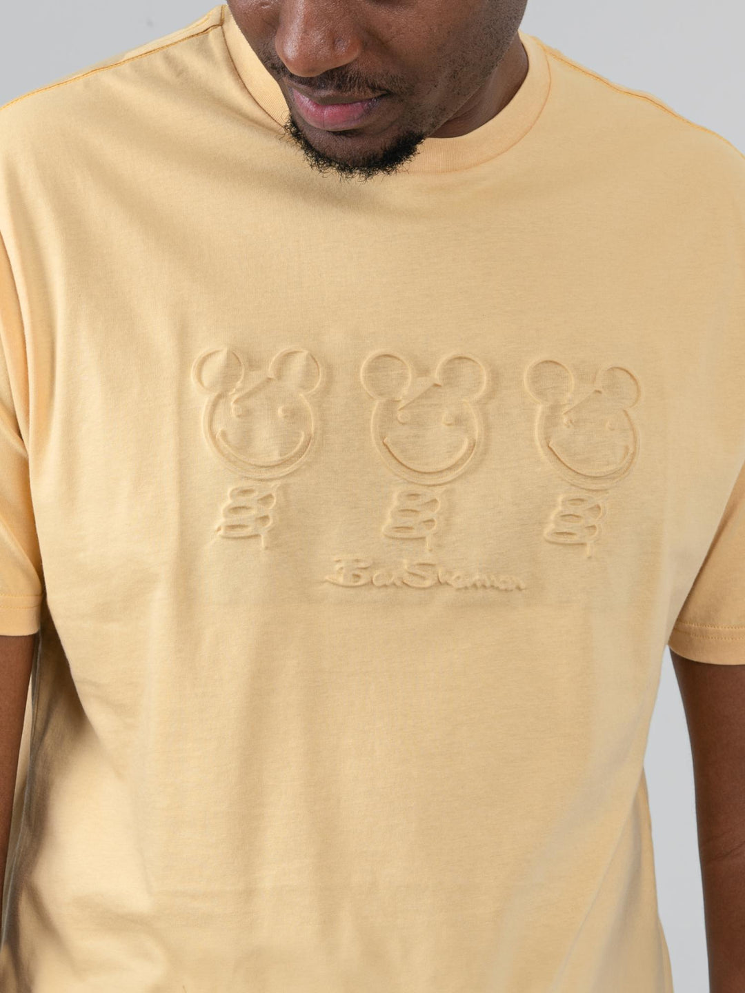 Close-up of three embossed bear graphics on Ben Sherman Trio Bears T-shirt in New Wheat