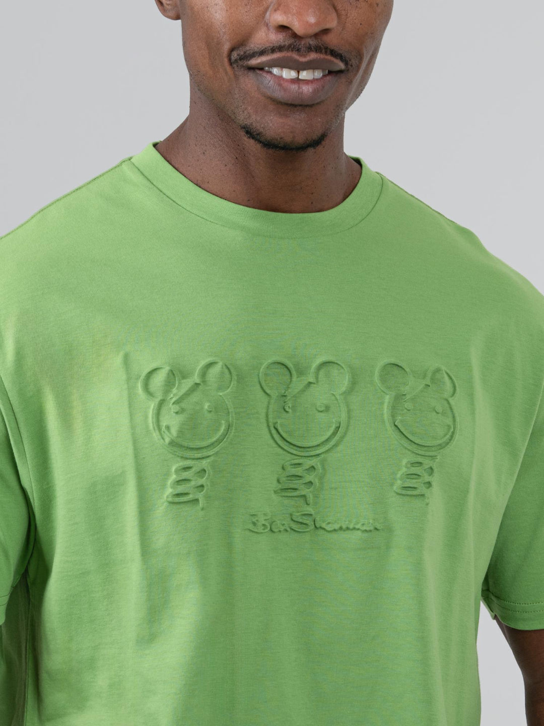 Close-up of three embossed bear graphics on Ben Sherman Trio Bears T-shirt in Piquant Green