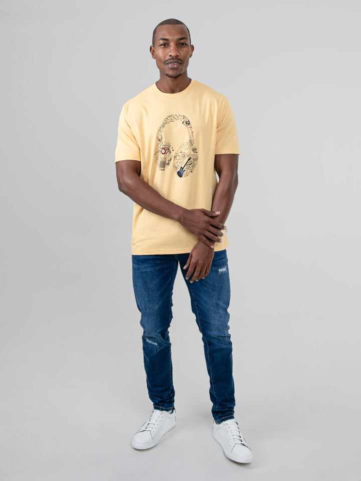aBen Sherman Typography Headphones Tee New Wheat - full-length front view on model, regular fit wheat tee with headphone graphic, styled with jeans