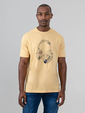 aBen Sherman Typography Headphones Tee New Wheat - front view on model, wheat cotton T-shirt with bold headphone graphic filled with music icons