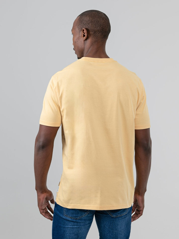 aBen Sherman Typography Headphones Tee New Wheat - back view on model showing plain wheat cotton back panel, styled with jeans